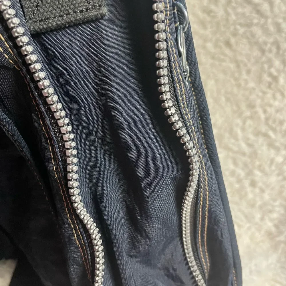 Kipling Nylon Expandable Navy Blue Large Messenger Bag  Key Clip. Black strap .